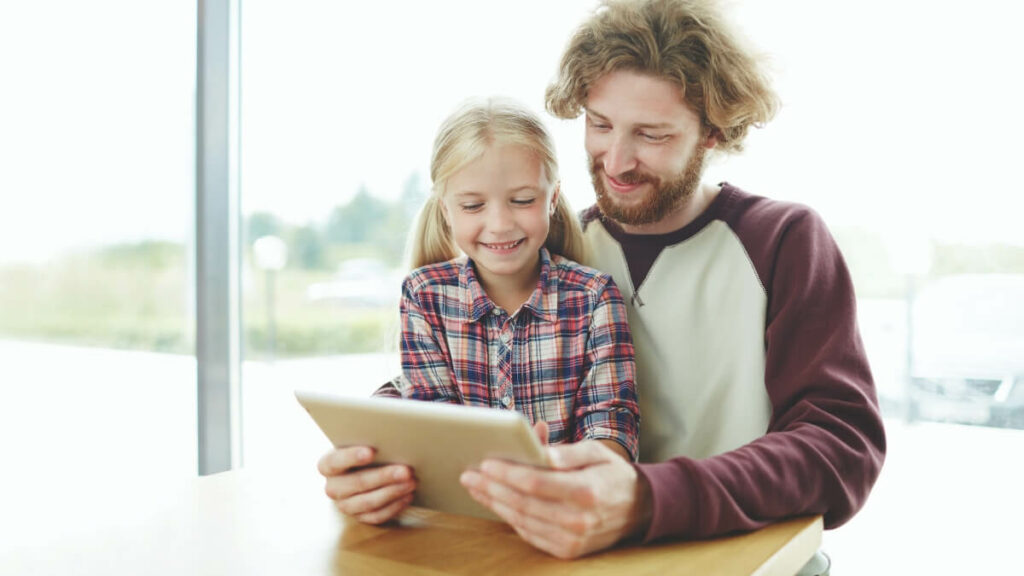 father teaching to his daughter